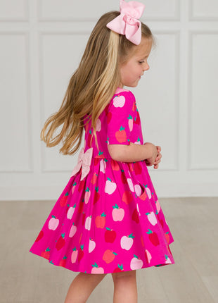 Model Wearing Rufflebutts+ Ruggedbutts Girls Apple of My Eye Short Sleeve Knit Twirl Dress