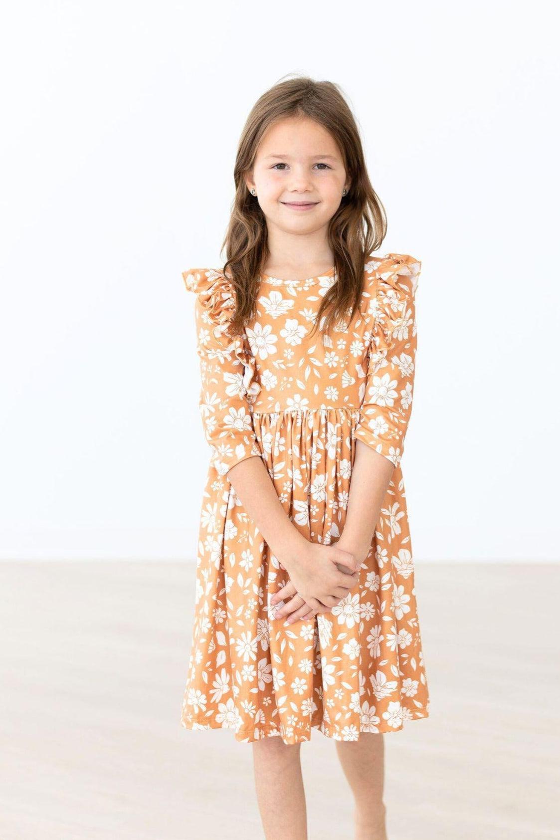 Model Wearing Mila & Rose Golden Blooms 3/4 Sleeve Ruffle Twirl Dress