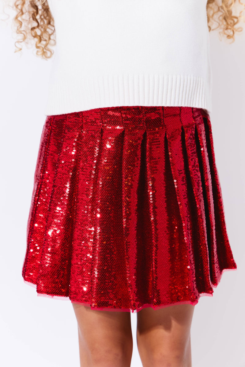 Model Wearing Lola And The Boys Scarlet Pleated Shimmer Skirt