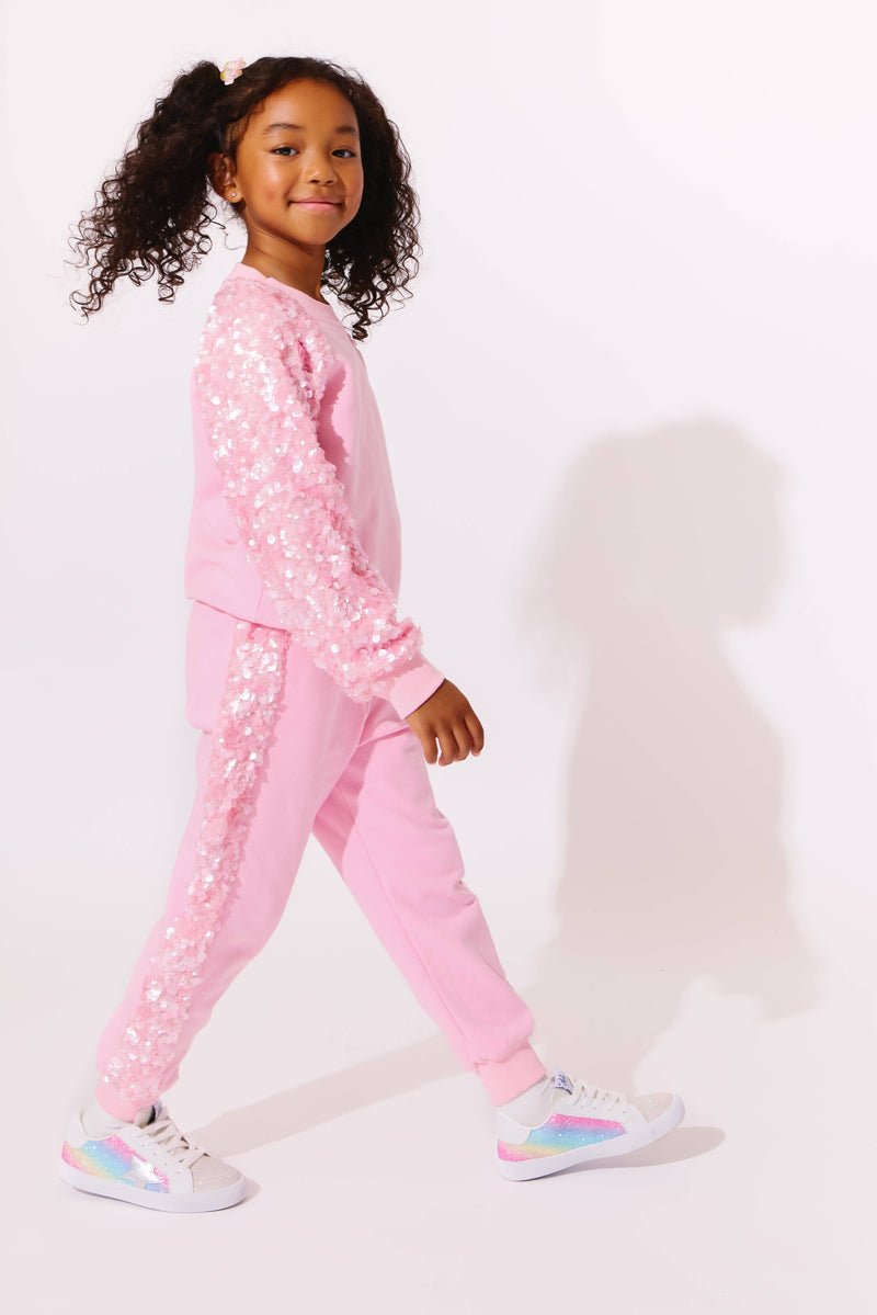 Model Wearing Lola And The Boys Pink Sequin Joggers Set