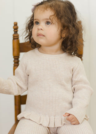 Model Wearing Quincy Mae Rib Knit Peplum Top || Heathered Oatmeal