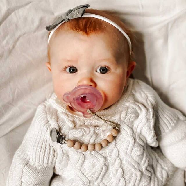 Model Using Ali+Oli Silicone Pacifier Clip (Beech Wood)