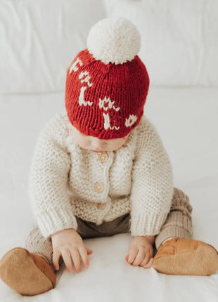Model Wearing Huggalugs Fa La La Hand Knit Pom Pom Beanie Hat