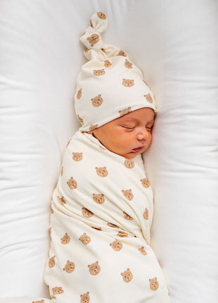Model Wearing Lou Lou & Company Teddy Swaddle Blanket and knot hat 