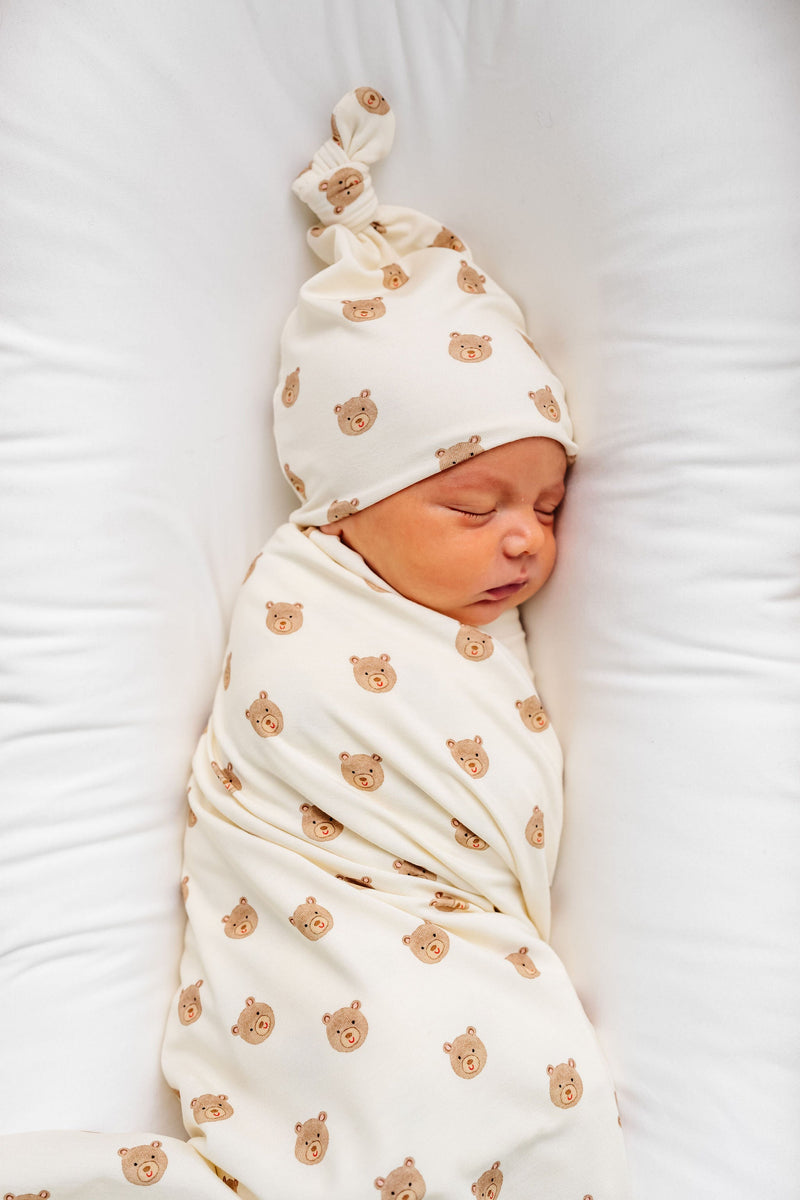 Model Wearing Lou Lou & Company Teddy Swaddle Blanket and knot hat 