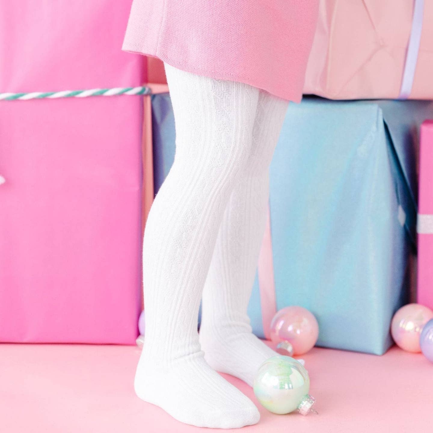 Model Wearing Little Stocking Co. White Cable Knit Tights