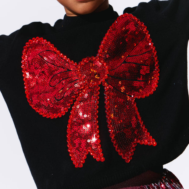 Model Wearing Lola And The Boys Big Bow Sweater