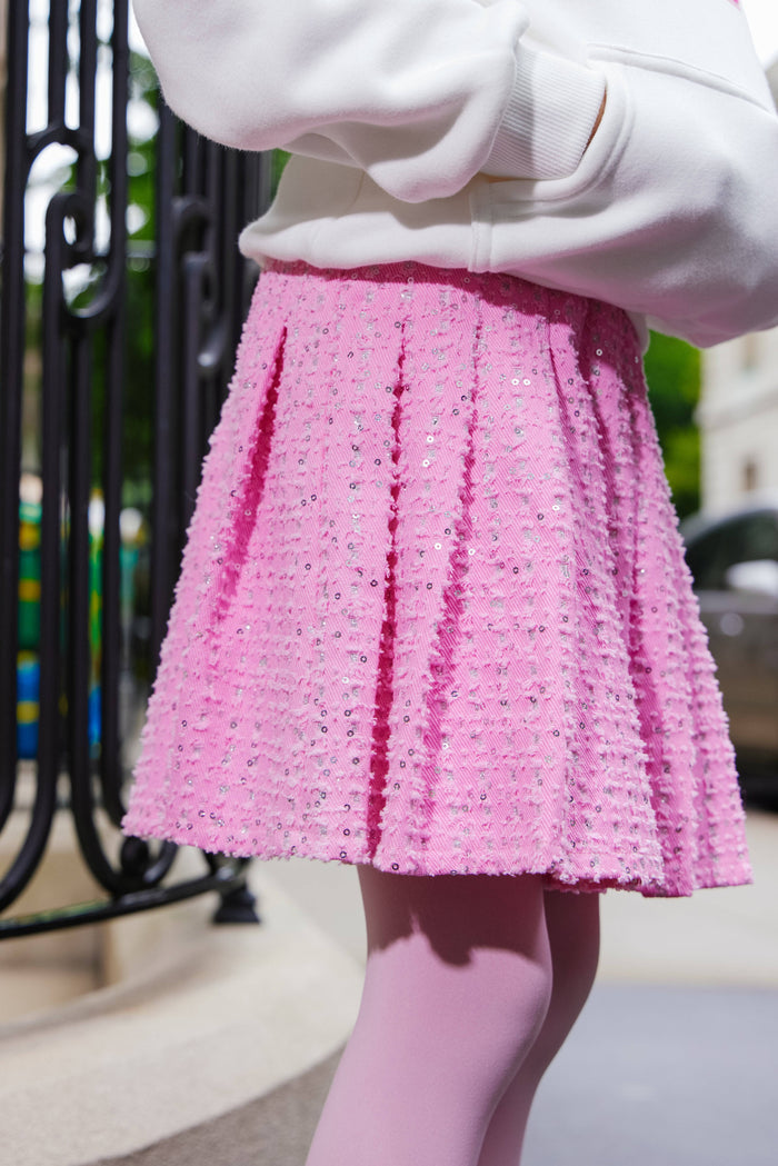 Model Wearing Lola And The Boys Pink Denim Sparkle Pleated Skirt