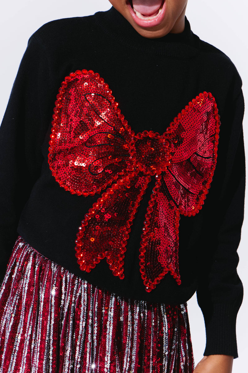 Model Wearing Lola And The Boys Big Bow Sweater