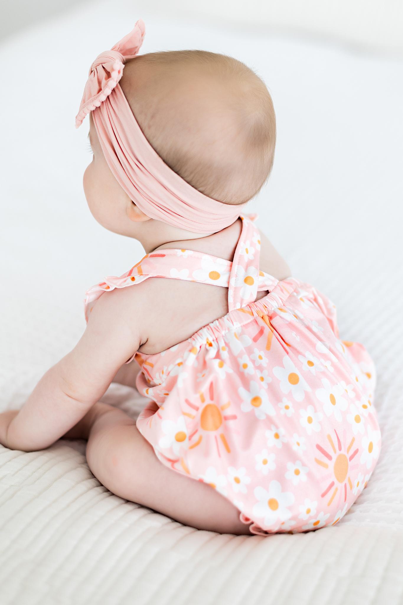 Model Wearing Mila & Rose Sweet & Sunny Ruffle Cross Back Romper