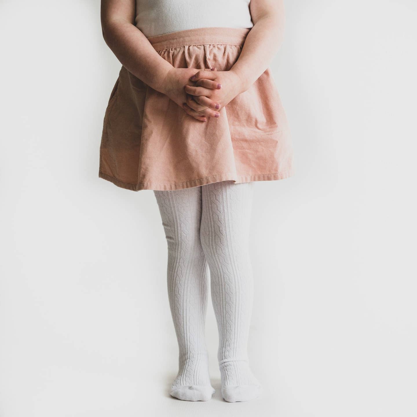 Model Wearing Little Stocking Co. White Cable Knit Tights