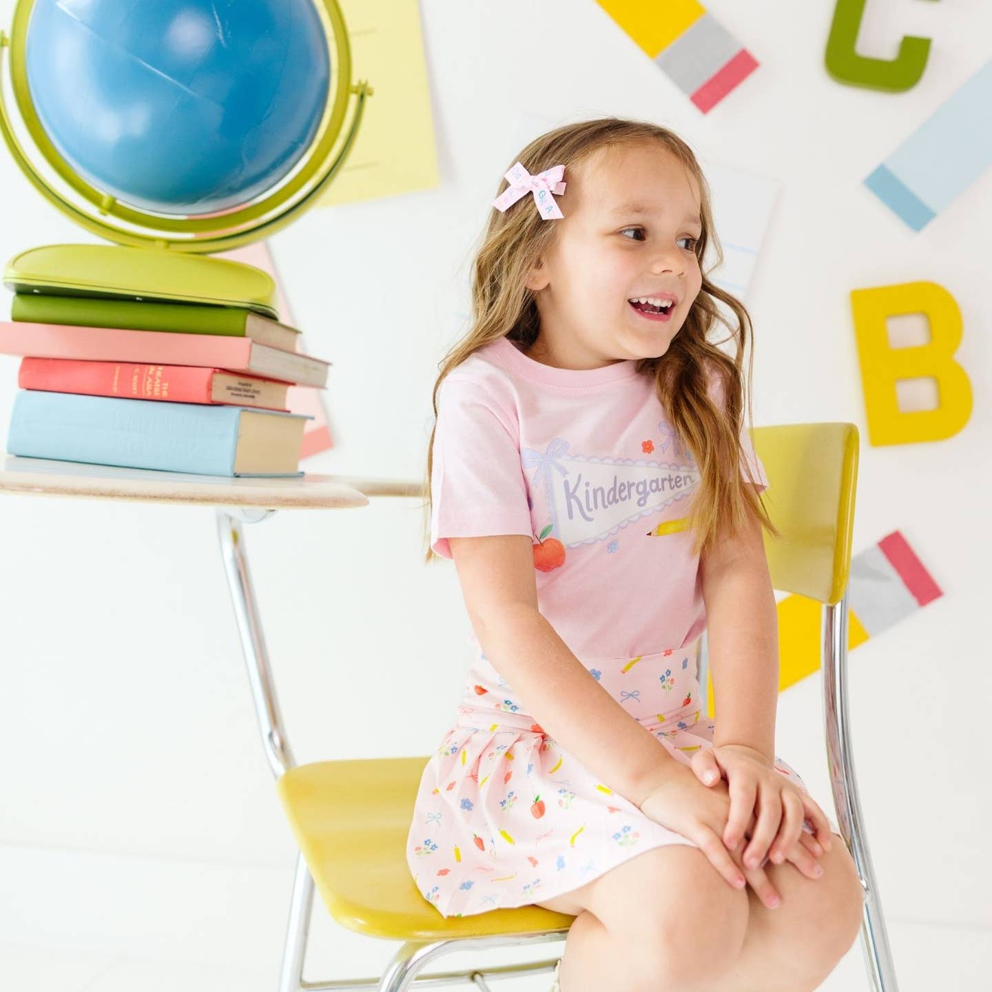 Model Wearing Sweet Wink Alphabet Bows Clip Set - Back To School - Hair Clips and Sweet Wink Kindergarten Pennant Short Sleeve T-Shirt - Back To School