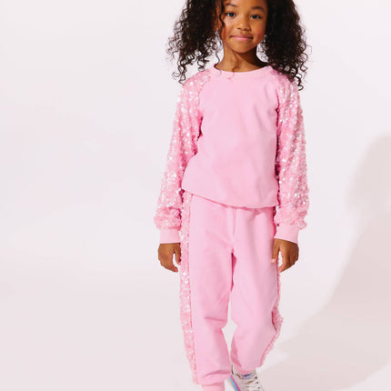 Model Wearing Lola And The Boys Pink Sequin Joggers Set