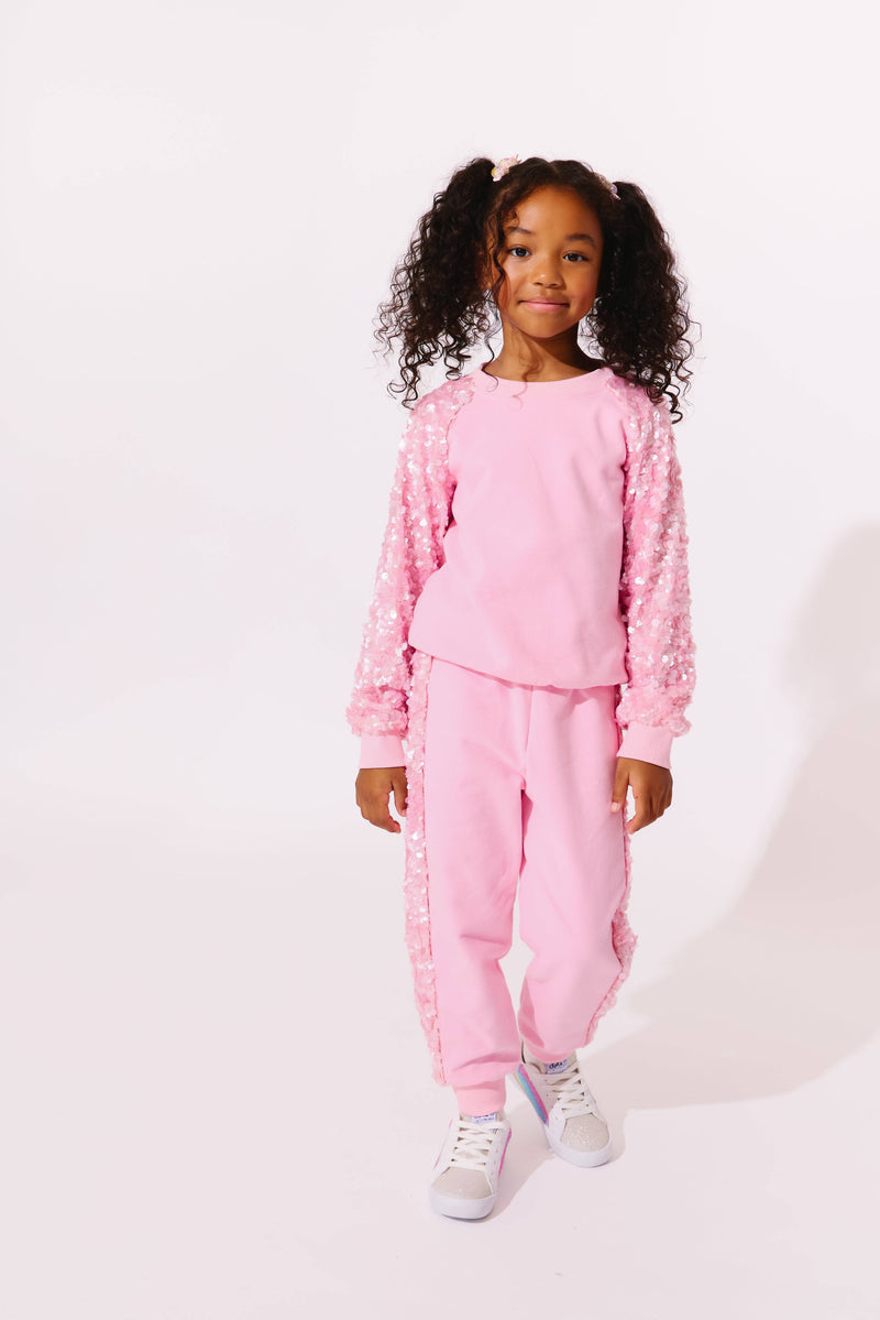 Model Wearing Lola And The Boys Pink Sequin Joggers Set