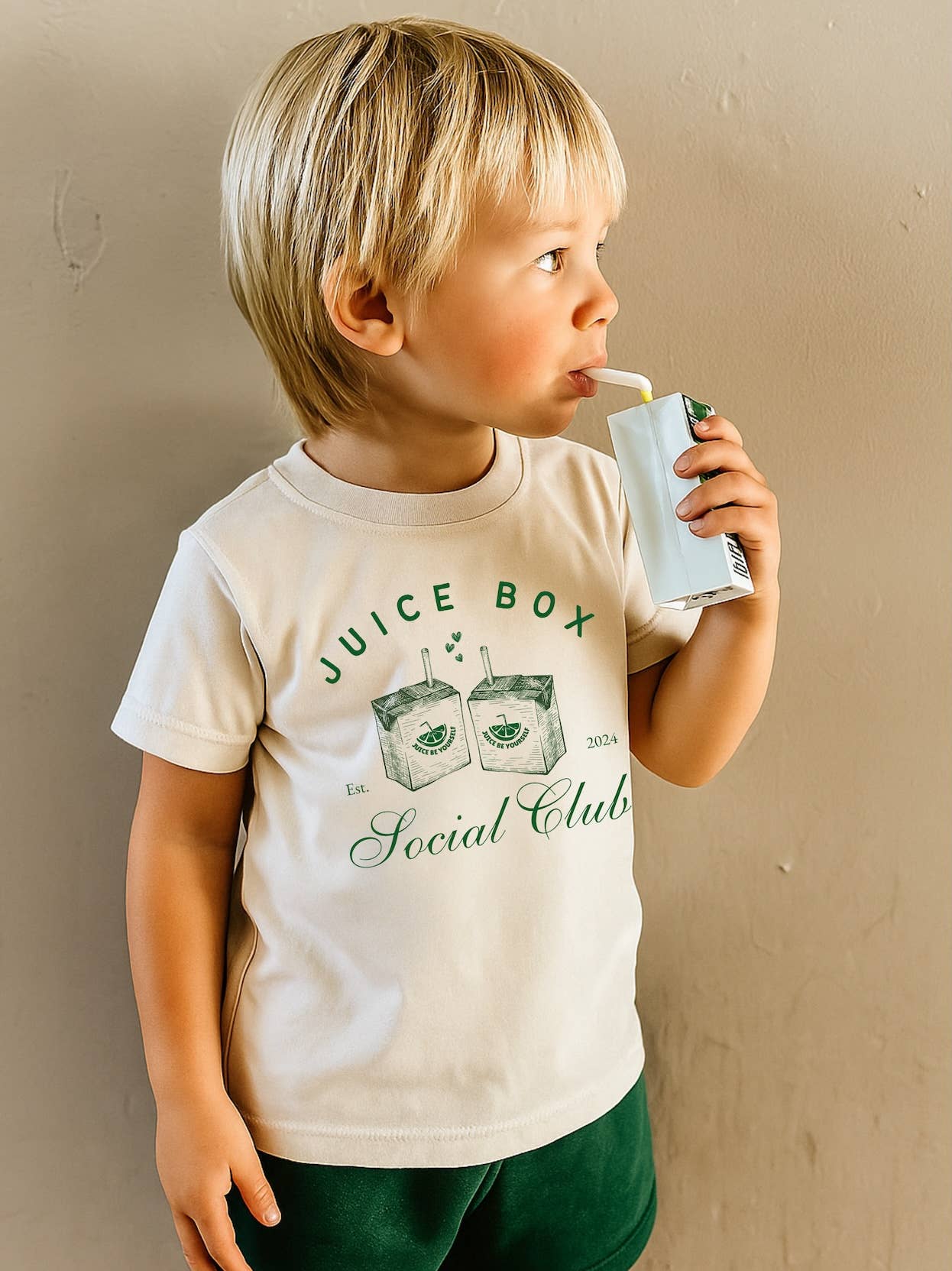 Model Wearing The Wishing Elephant Unisex Juice Box Social Club Tee Shirt For Kids, Tshirt