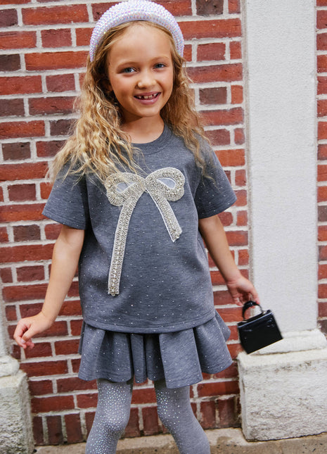 Model Wearing Lola & The Boys Sparkle Bow Charm Skirt Set