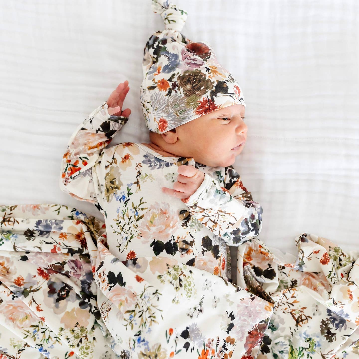 Model Wearing Lou Lou & Company Nellie Top Knot Hat & Swaddle Blanket