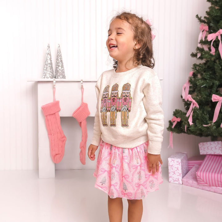 Model Wearing Sweet Winks Pastel Nutcracker Patch Christmas Sweatshirt - Natural