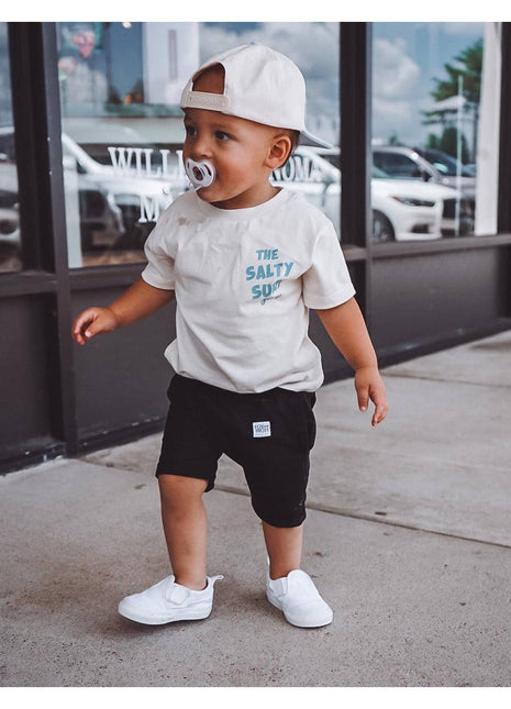 Model Wearing AK Clothing Company, LLC Salty Surf Shop Graphic Tee