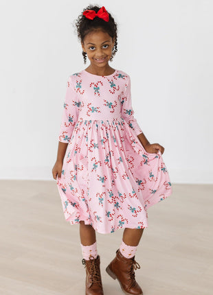 Model Wearing Mila & Rose Candy Cane Cutie 3/4 Sleeve Pocket Twirl Dress