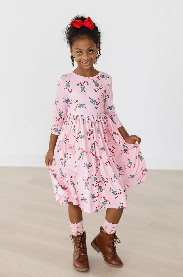 Model Wearing Mila & Rose Candy Cane Cutie 3/4 Sleeve Pocket Twirl Dress