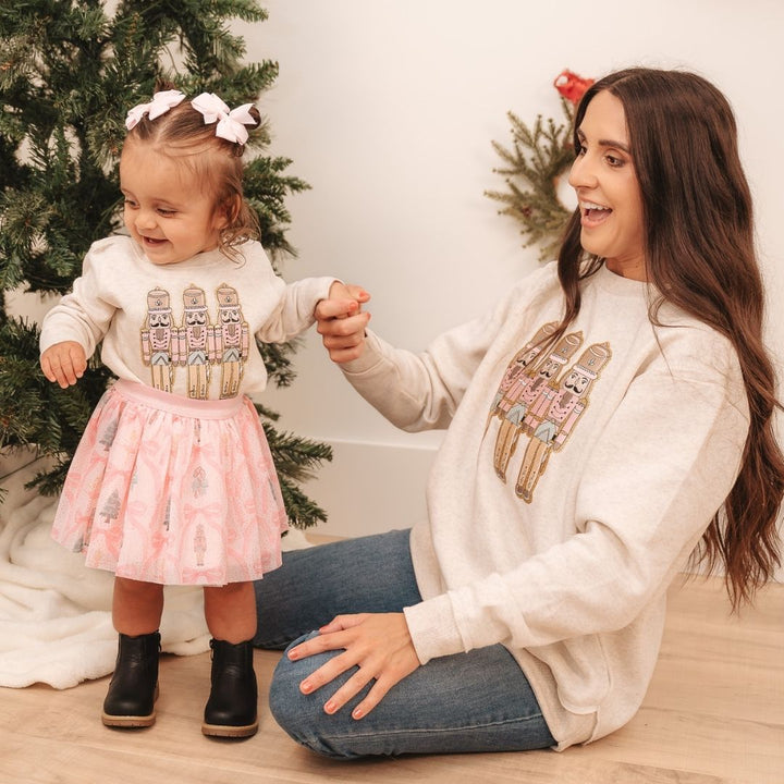 Mommy & Me Models Wearing Sweet Winks Pastel Nutcracker Patch Christmas Sweatshirt - Natural