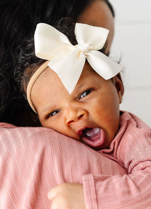 Model Wearing Lou Lou & Company Satin Bow - Cream Headband