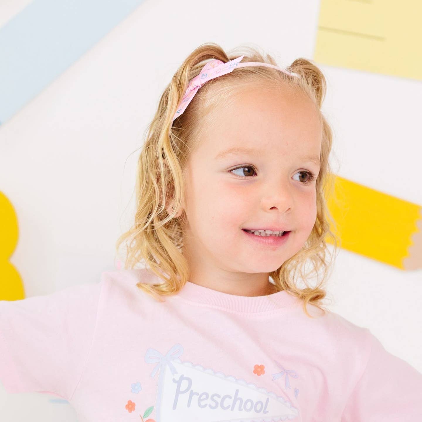 Model Wearing Sweet Wink Alphabet Bows Headband - Back To School - Kids Hair