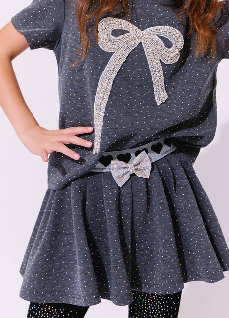 Model Wearing Lola & The Boys Sparkle Bow Charm Skirt Set