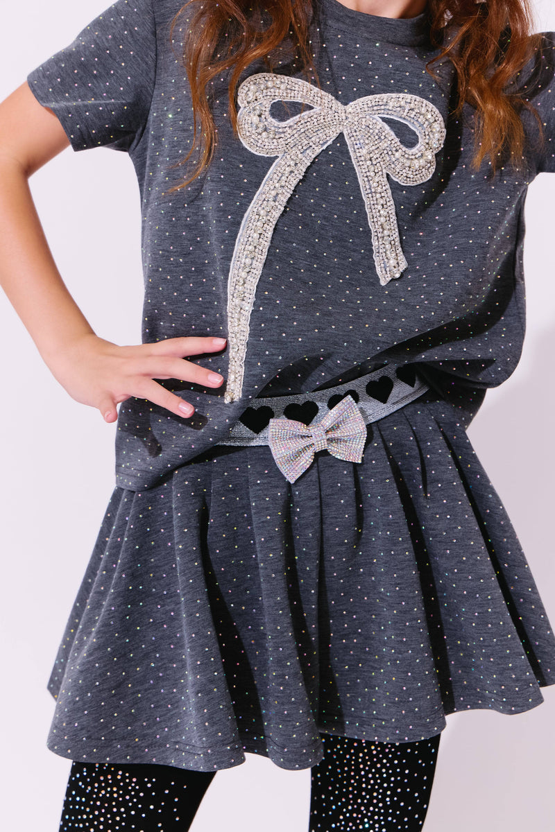Model Wearing Lola & The Boys Sparkle Bow Charm Skirt Set