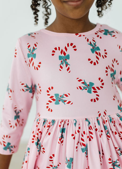 Model Wearing Mila & Rose Candy Cane Cutie 3/4 Sleeve Pocket Twirl Dress