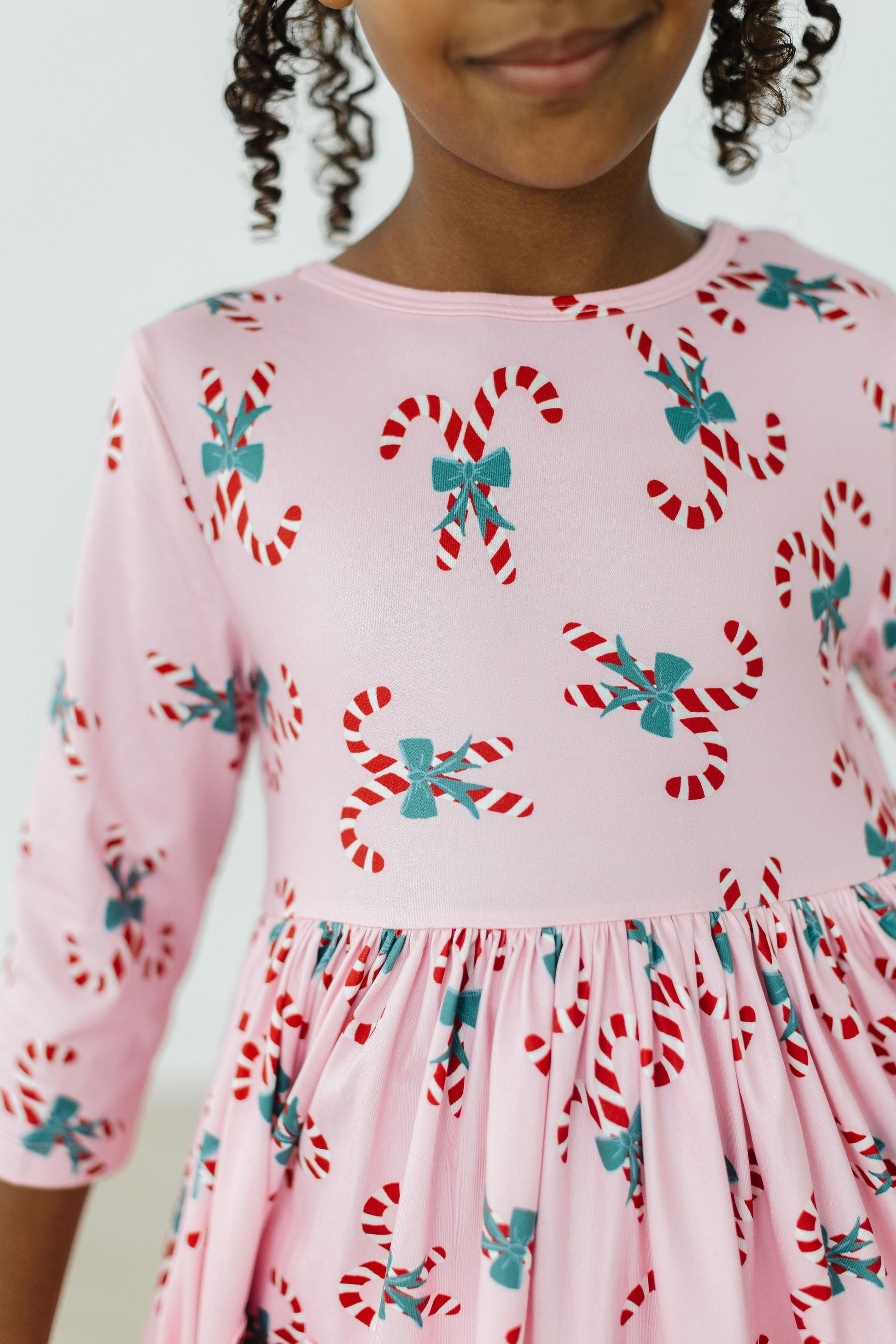 Model Wearing Mila & Rose Candy Cane Cutie 3/4 Sleeve Pocket Twirl Dress