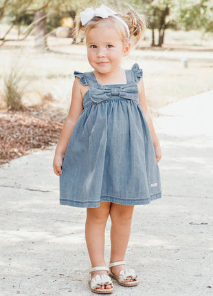 Model Wearing Rufflebutts & Ruggedbutts Girls Light Wash Denim Flutter Bow Woven Dress 