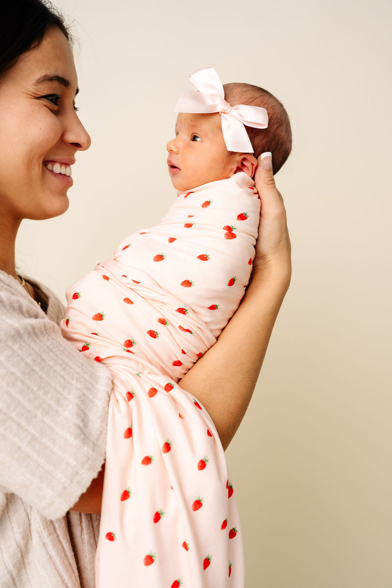 Model Wearing Lou Lou & Company Junie Swaddle Blanket