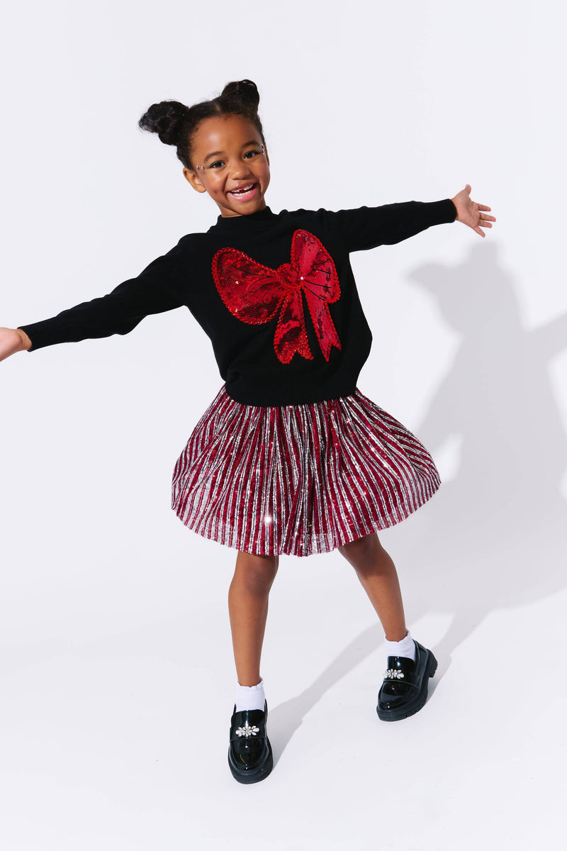 Model Wearing Lola And The Boys Big Bow Sweater