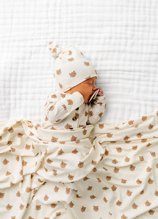 Model Wearing Lou Lou & Company Teddy Knotted Gown, knot hat, and swaddle blanket