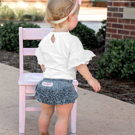 Model Wearing Rufflebutts+ Ruggedbutts Baby Girls Light Wash Denim Rufflebutt Bloomer