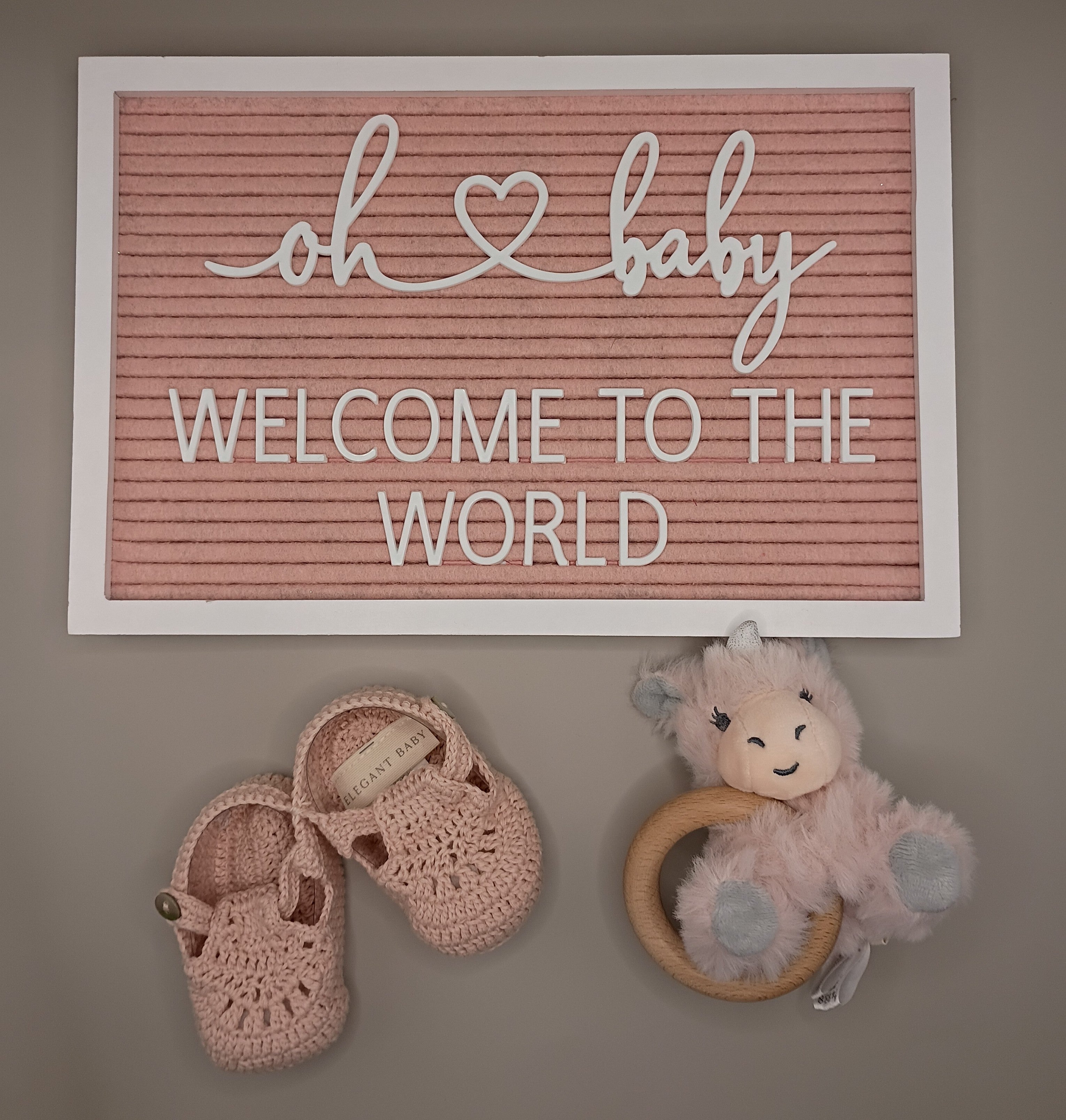 "Welcome To The World" Sign