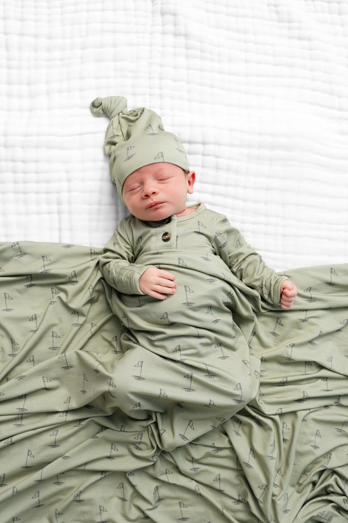 Model Wearing Lou Lou & Company Cal Swaddle Blanket & Knotted Hat