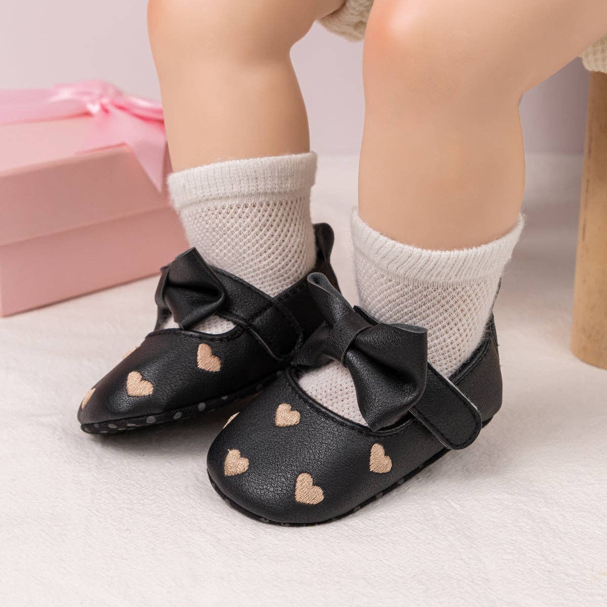 Model Wearing Kids Charm Online Black W/Gold Heart Infant Shoes with Velcro. HMZ1615