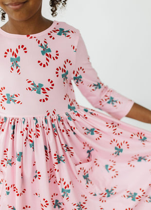 Model Wearing Mila & Rose Candy Cane Cutie 3/4 Sleeve Pocket Twirl Dress