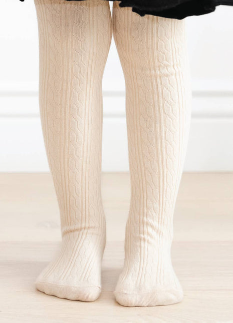 Model Wearing Little Stocking Co. Vanilla Cable Knit Tights