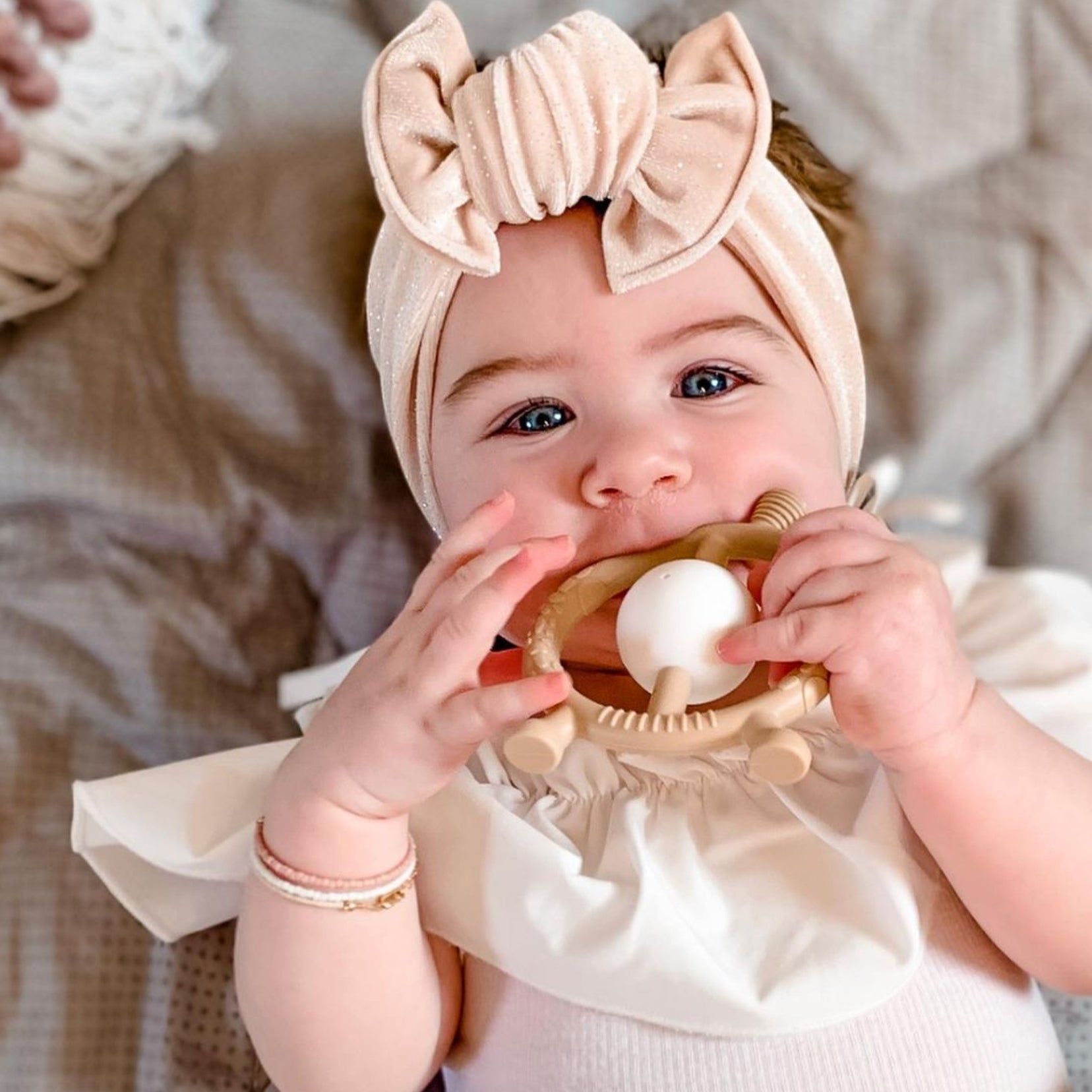 Model Using Ali + Oli Giraffe Teether & Rattle Food-Grade Silicone Toy (Taupe)