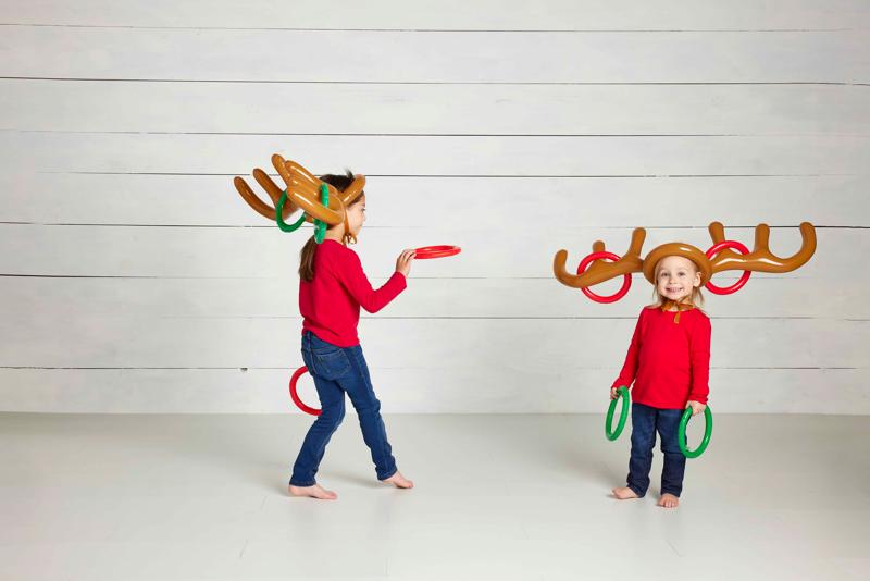 Kids playing Mudpie Reindeer Ring Toss Game Set