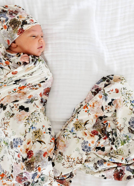 Model Wearing Lou Lou & Company Nellie Top Knot Hat & Swaddle Blanket