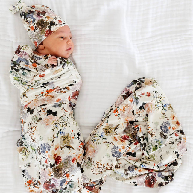 Model Wearing Lou Lou & Company Nellie Top Knot Hat & Swaddle Blanket