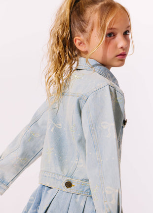 Model Wearing Lola And The Boys Sparkle Bows Denim Pleated Skirt