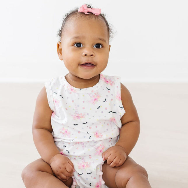 Model Wearing One Of A Kind Pom Pom Romper