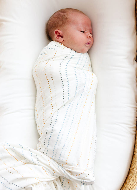 Model Wearing Lou Lou & Company Conrad Swaddle Blanket