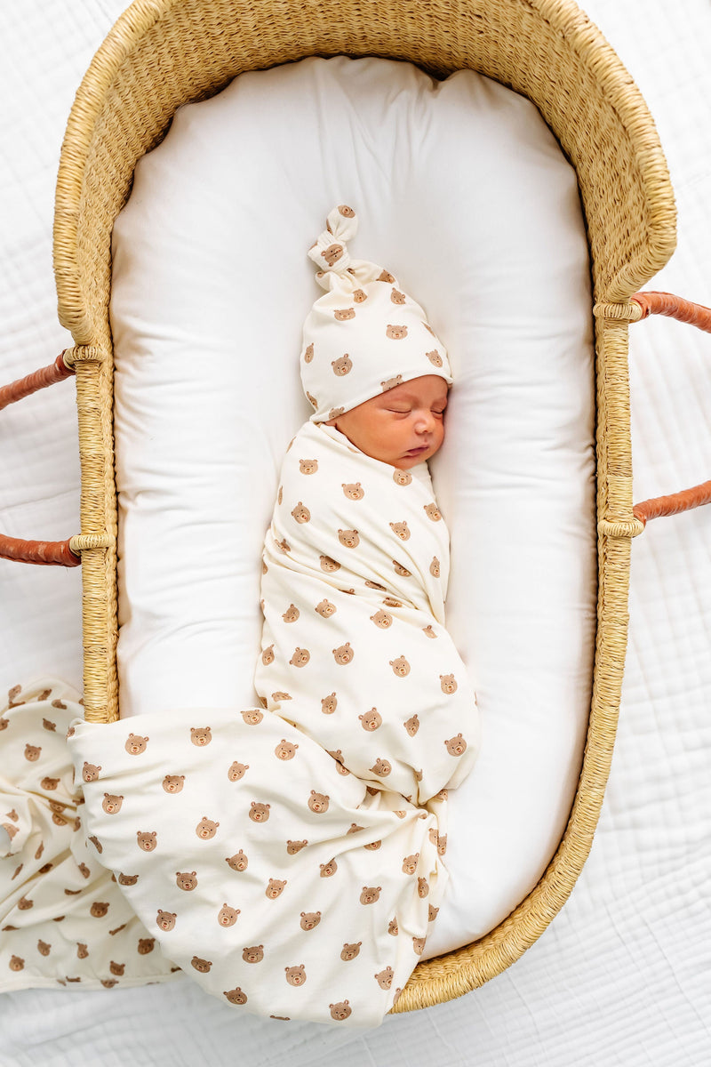 Model Wearing Teddy Swaddle Blanket and knot hat